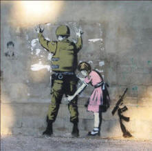 A picture of a little girl in a bright pink dress frisking an Israeli soldier
